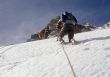 Climbers on steep snow face