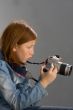Girl with SLR photo camera