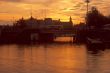 Sunset, bridge and sail boat