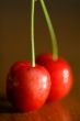 Two red cherries.
