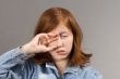 rubbing eyes