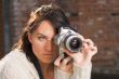Girl with SLR photo camera