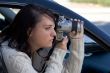 Girl with SLR photo camera