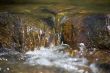 little rill with brown stones and rocks