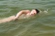 boy swims the crawl