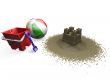 Sandcastle with beach ball, bucket and spade