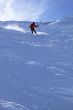 Red skier in powder snow,
