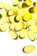 Close up of yellow gel capsules.