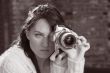 Girl with SLR photo camera