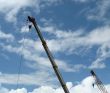 Double construction crane against blue sky