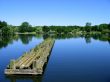 Very clear blue water with sky and a strange pier