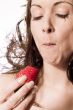 Eating a strawberry