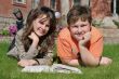 smiling children with a book