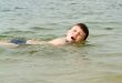 boy swims the crawl