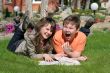 smiling boy and girl with a book