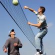 Couple men playing volleyball