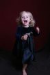happy little girl in party dress with toy