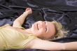 happy woman on the bed
