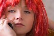attractive woman in wig with mobile phone