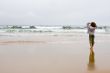 girl looking at surfers