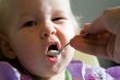 child eating pap