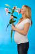 happy pregnant woman with flower