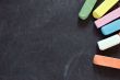 blackboard with coloured crayons