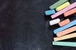 blackboard with coloured crayons