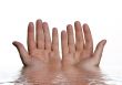 Open hands from water