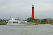 luxury yacht near lighthouse