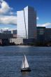 skyscraper with sail boat and waterview