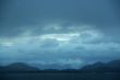 Dark clouds, shadowy blue ridges