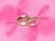 Wedding rings on pink fantasy background