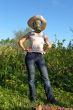 woman in gas-mask at garden work