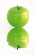 green apple reflecting in a water