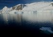 Mountains & glaciers reflected in calm ocean
