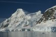 Mountains & glaciers reflected in calm ocean