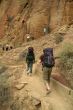 Climbers approaching rock face