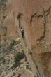 Climber on overhanging cliff