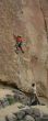 Climber on unprotected face route