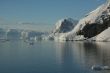 Mountains & glaciers reflected in calm ocean