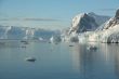 Mountains & glaciers reflected in calm ocean