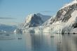 Mountains & glaciers reflected in calm ocean
