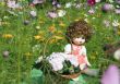 Doll on a glade of colors