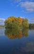 autumn island reflecting in water