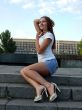 beautiful young sexual girl sitting on the stairs