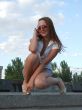 beautiful young sexual girl sitting on the stairs