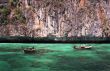 longtail boats in turquoise waters