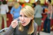 Eating girl with spoon in fast food restaurant #2