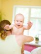 Mother holding enjoying baby